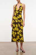 Sleeveless halter midi dress with yellow daisy print on dark fabric