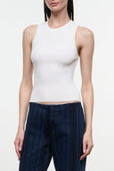 White ribbed tank top with sleeveless crew neck, fitted cropped hem