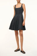 Black sleeveless mini dress with square neckline, fitted bodice, and flared skirt