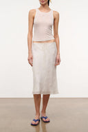 Ivory sleeveless tank top with scoop neckline and racerback seams