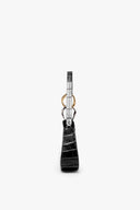 Black croc-embossed bag with short strap and gold-tone keyring clasp