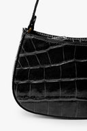 Black croc-embossed hobo bag close-up with curved edge and top handle