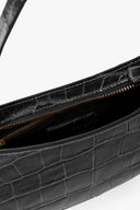 Black croc-embossed hobo bag interior with zip opening and gold zipper pull